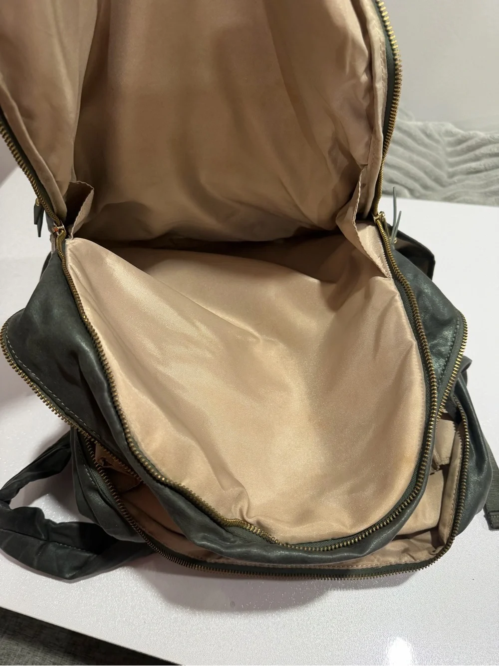 Kipling Metallic Dark Green Backpack with Gold Hardware
